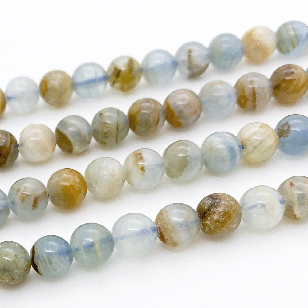 Кальцит голубой, размер около 6,3-6,4 мм, цена за 14-15 шт (1/4 нити)