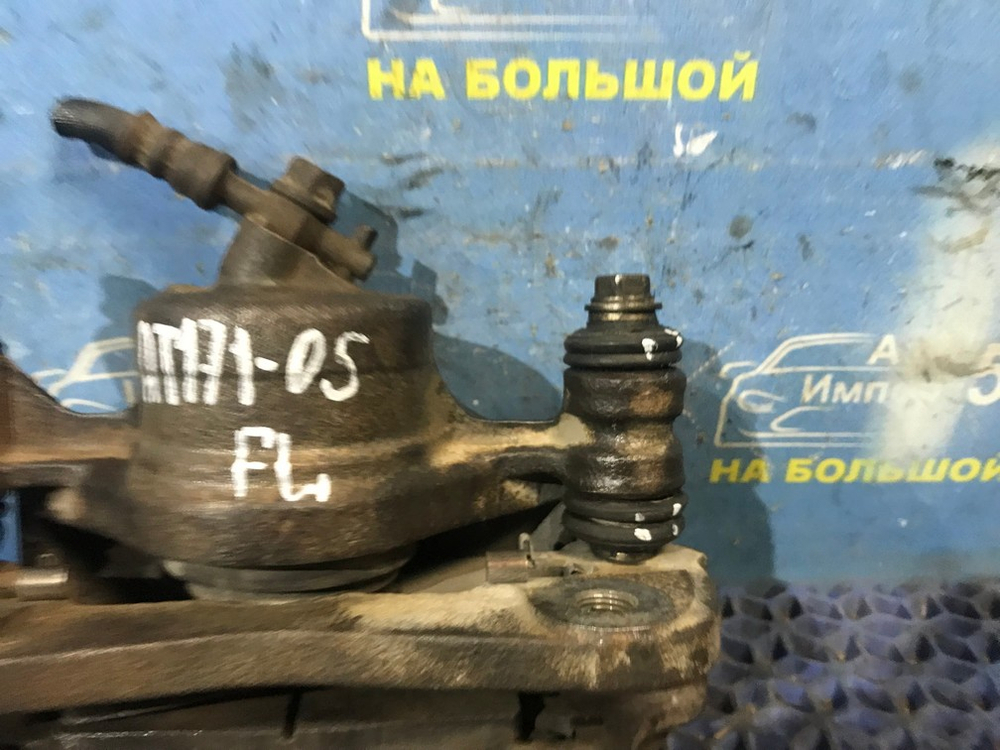 Суппорт тормозной передний левый TOYOTA CARINA 1990