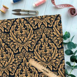 Ткань атлас бронзовый симметричный узор на чёрном фоне