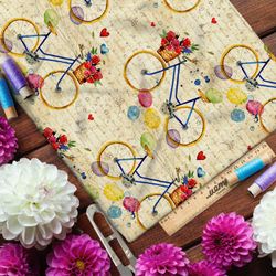 Ткань кулирная гладь велосипеды с щариками и розами на фоне письма