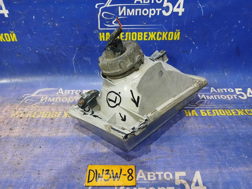 Фара передняя левая MAZDA DEMIO 1998