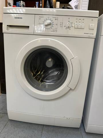 Стиральная машина Siemens WXS1063OE Б/У фронтальная 4 кг 1000 об/мин