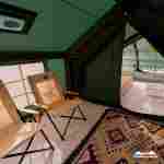 Пневмокаркасная всесезонная палатка «Тёплая Искра» 3,6×4,8×2,2 м — с печкой, из ПВХ, зелёная