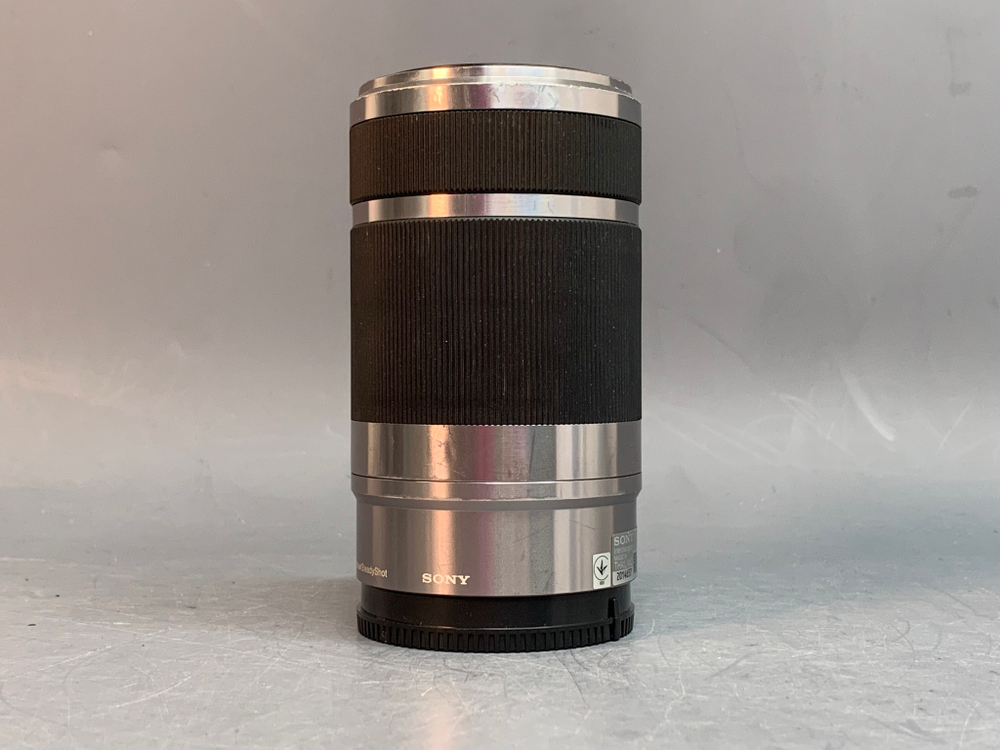 Sony 55-210mm f/4.5-6.3 E OSS внутри налет в виде точек