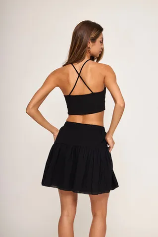 Мини юбка-лепесток из жатого хлопка черного цвета