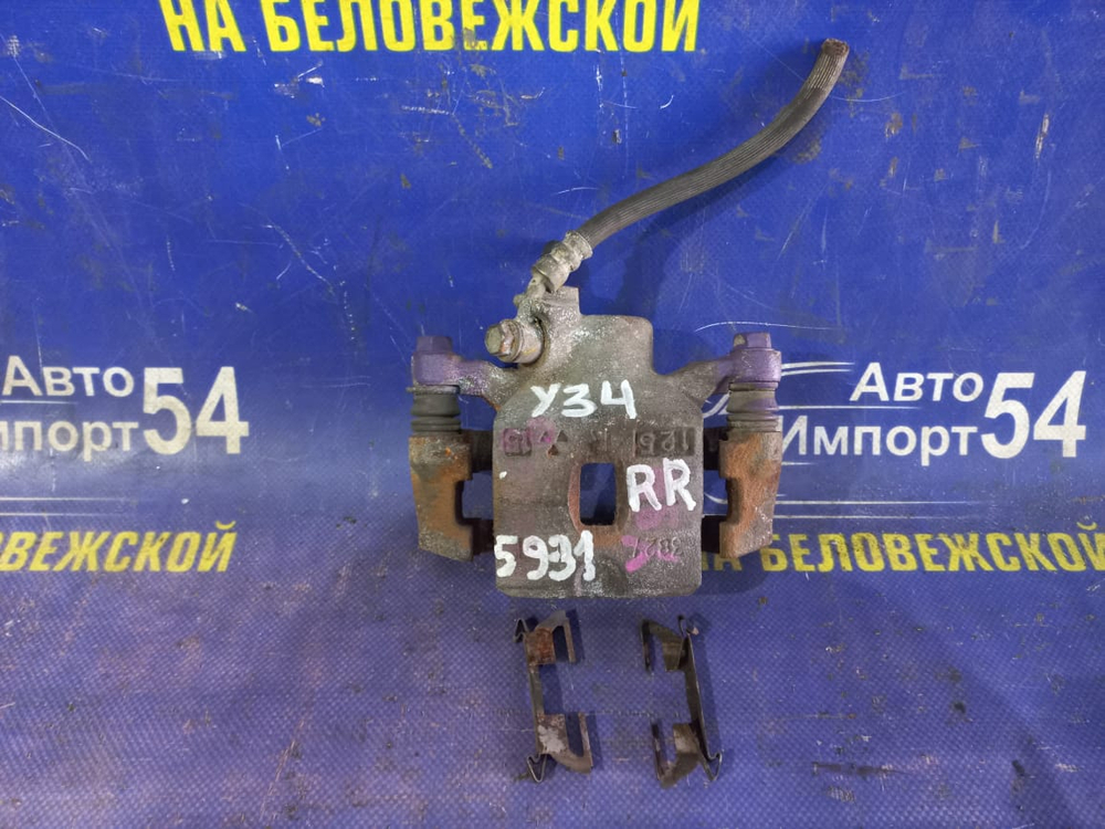 Суппорт тормозной задний правый NISSAN CEDRIC 1999-2004