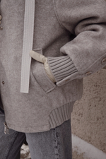 Пуховик средней длины из шерсти с капюшоном