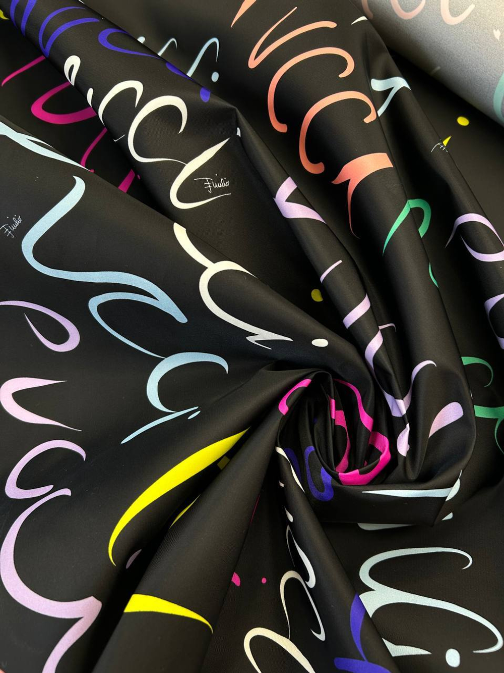 Курточно-плащевая ткань п/э Emilio Pucci черная с разноцветными надписями и лого