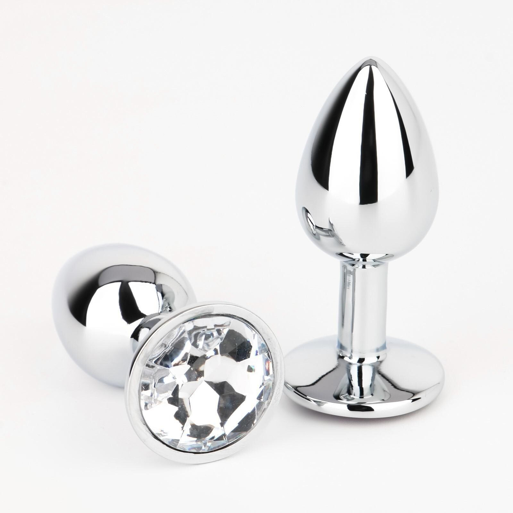 Серебристая анальная втулочка с прозрачным кристаллом - 7 см. (Цвет: серебристый)
