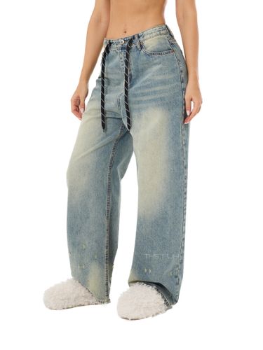 Голубые джинсы-трансформеры с потертостями по низу