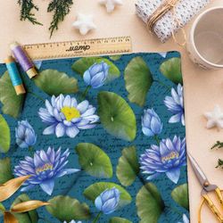 Ткань шифон голубые кувшинки на бирюзовом фоне с надписями