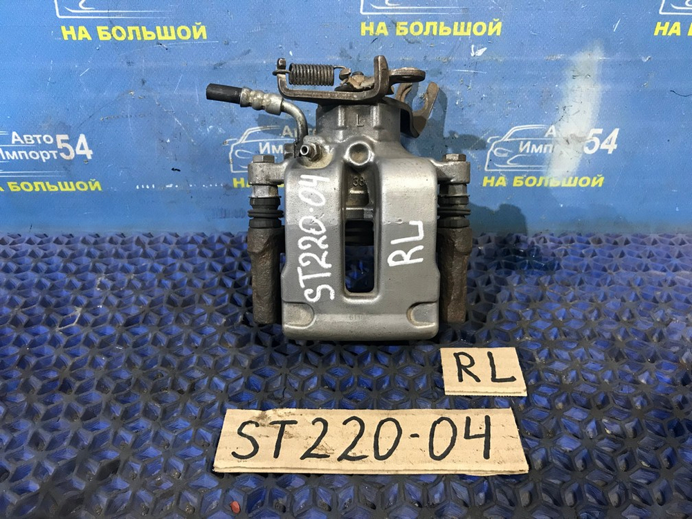 Суппорт тормозной задний левый TOYOTA AVENSIS 2001