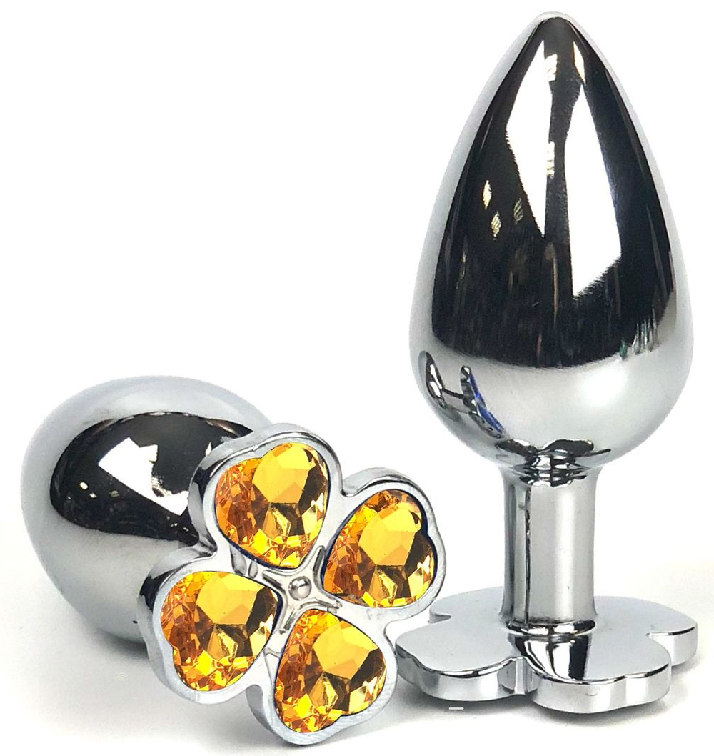 Серебристая анальная втулка с клевером из оранжевых кристаллов - 6 см. (Цвет: оранжевый)