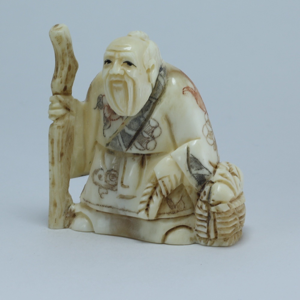 Эксклюзивная нэцкэ Монах с посохом и корзиной рыбы