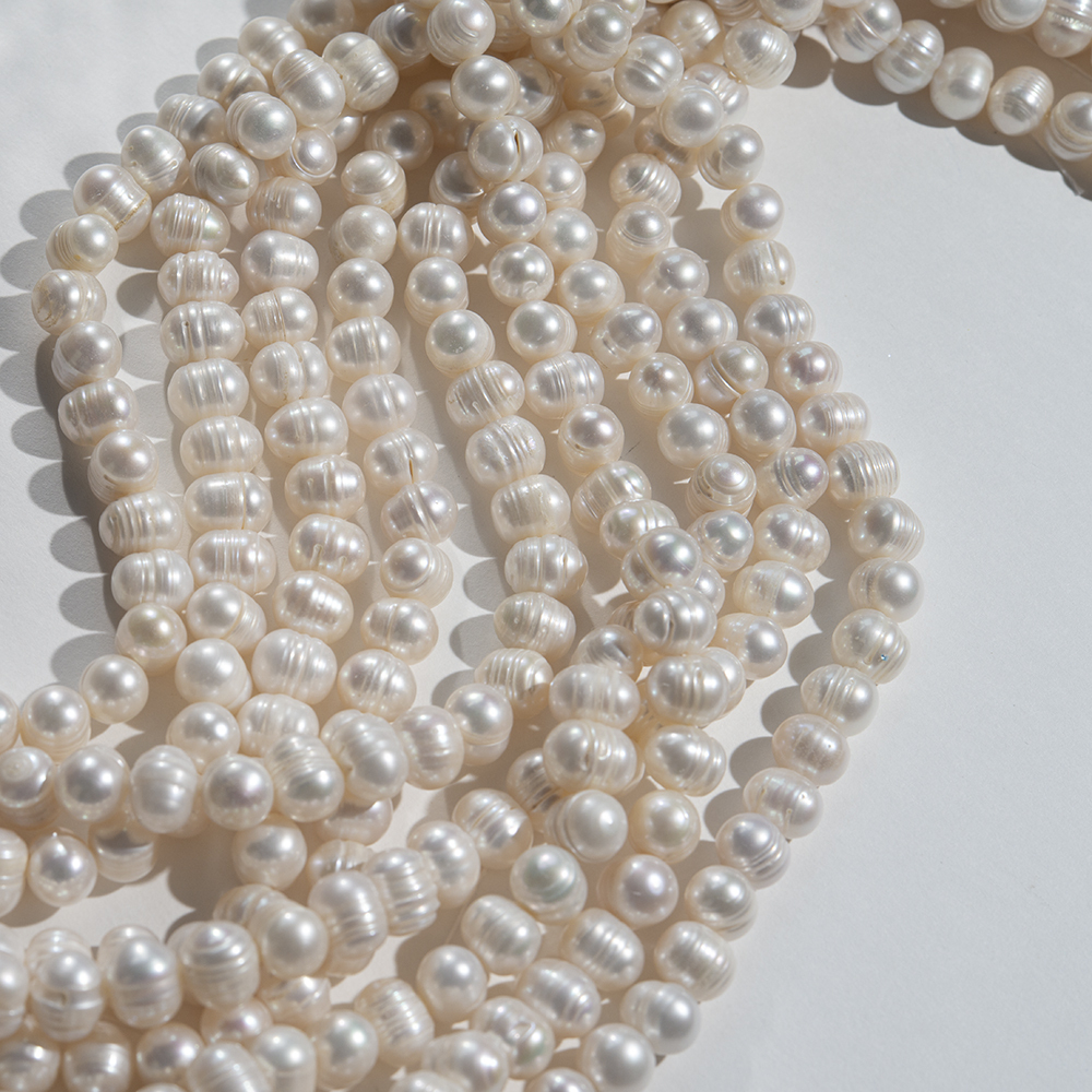 Жемчуг культивированный крупный овальный с бороздками, белый, 11*8мм