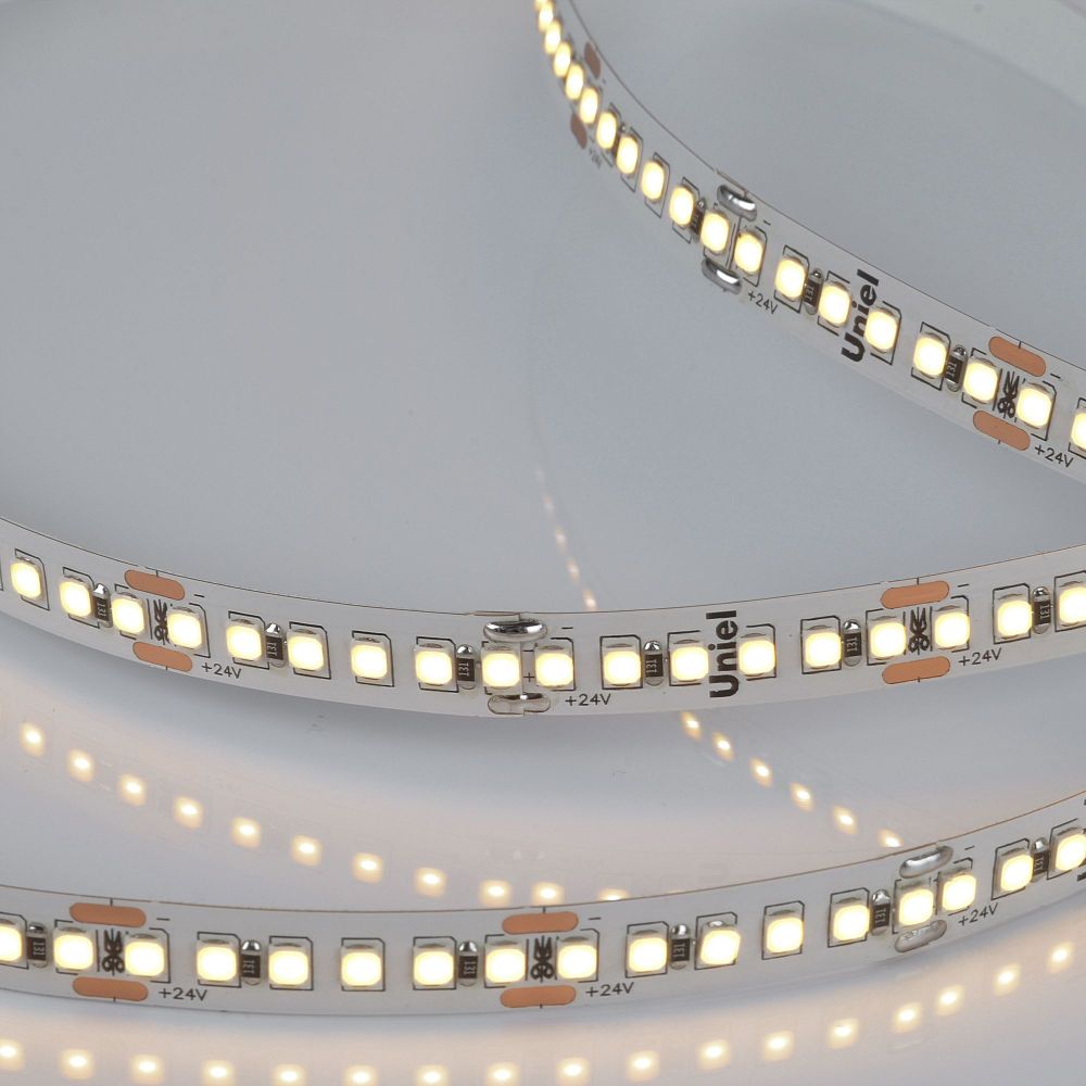 ULS-2835-180LED-m-10mm-IP20-DC24V-17W-m-5M-3000K Гибкая светодиодная лента на самоклеящейся основе. Катушка 5м. в герметичной упаковке. Теплый белый свет3000К. ТМ Uniel