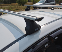 Багажник Интер Спектр на крышу Fiat Doblo 2001-2015 в штатные места 8892 крыловидные дуги 130 см.