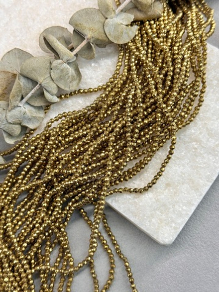 Гематит темное золото, граненный шар 3 мм, нить 40 см