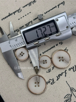 Пуговицы на прокол светло-бежевые с прожилками в золотистом металлическом обрамлении