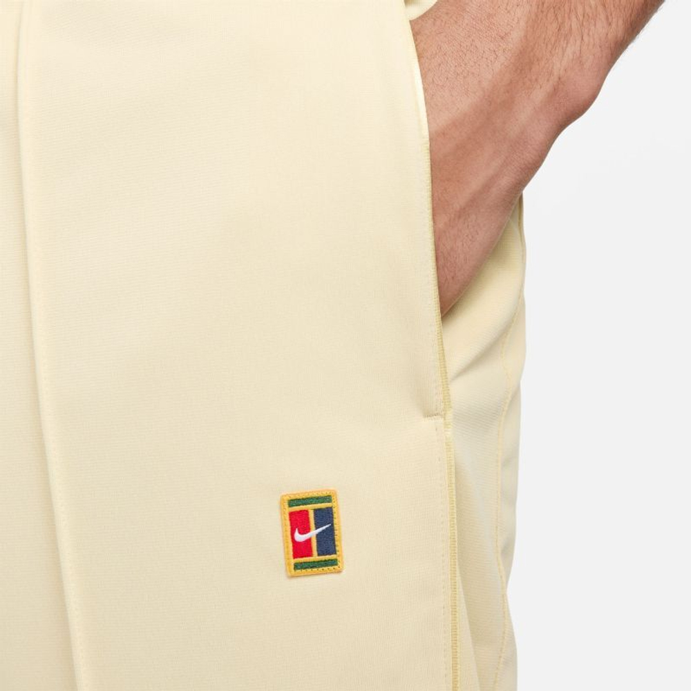 Мужские теннисные штаны Nike Court Heritage Suit Pant - team gold
