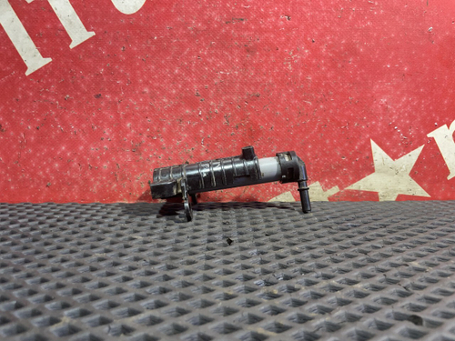 Форсунка омывателя фар правая