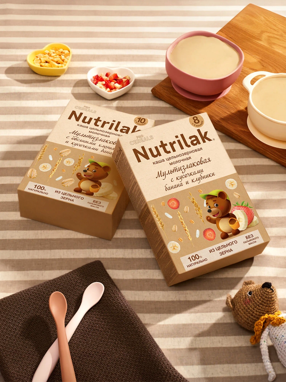 Каша молочная сухая Nutrilak Premium Procereals мультизлаковая с кусочками банана и клубники 200г