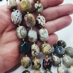 Океаническая яшма, риолит, крупная галтовка, 12-15 мм, овалы, цена за нить 12.5 - 13 см (1/3 нити)