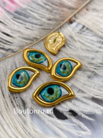 Пуговицы золотистые Скиапар. с эмалью "Глаз"