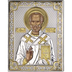 Икона Николая Угодника в серебряном окладе.