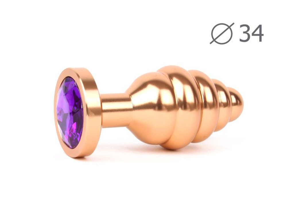 Коническая ребристая золотистая анальная втулка с кристаллом фиолетового цвета - 8 см. (Цвет: фиолетовый)