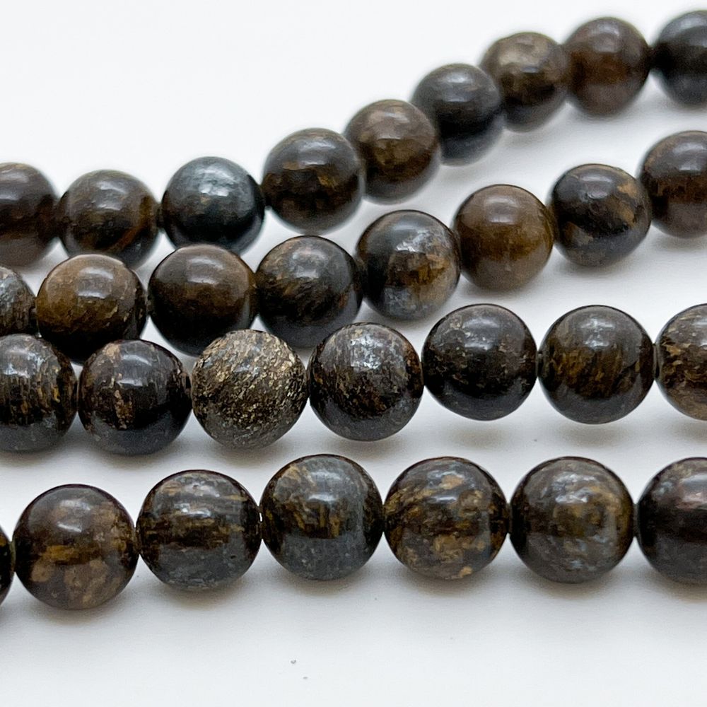 Бронзит бусины, диаметр около 8,5-8,7 мм, цена за 11 шт (1/4 нити)