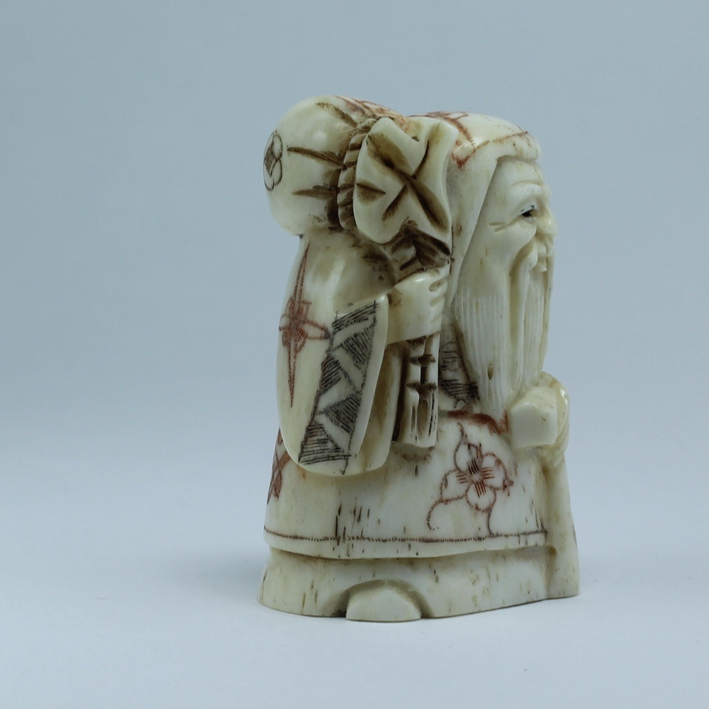 Нэцкэ Фукурокудзю с посохом и мешком риса