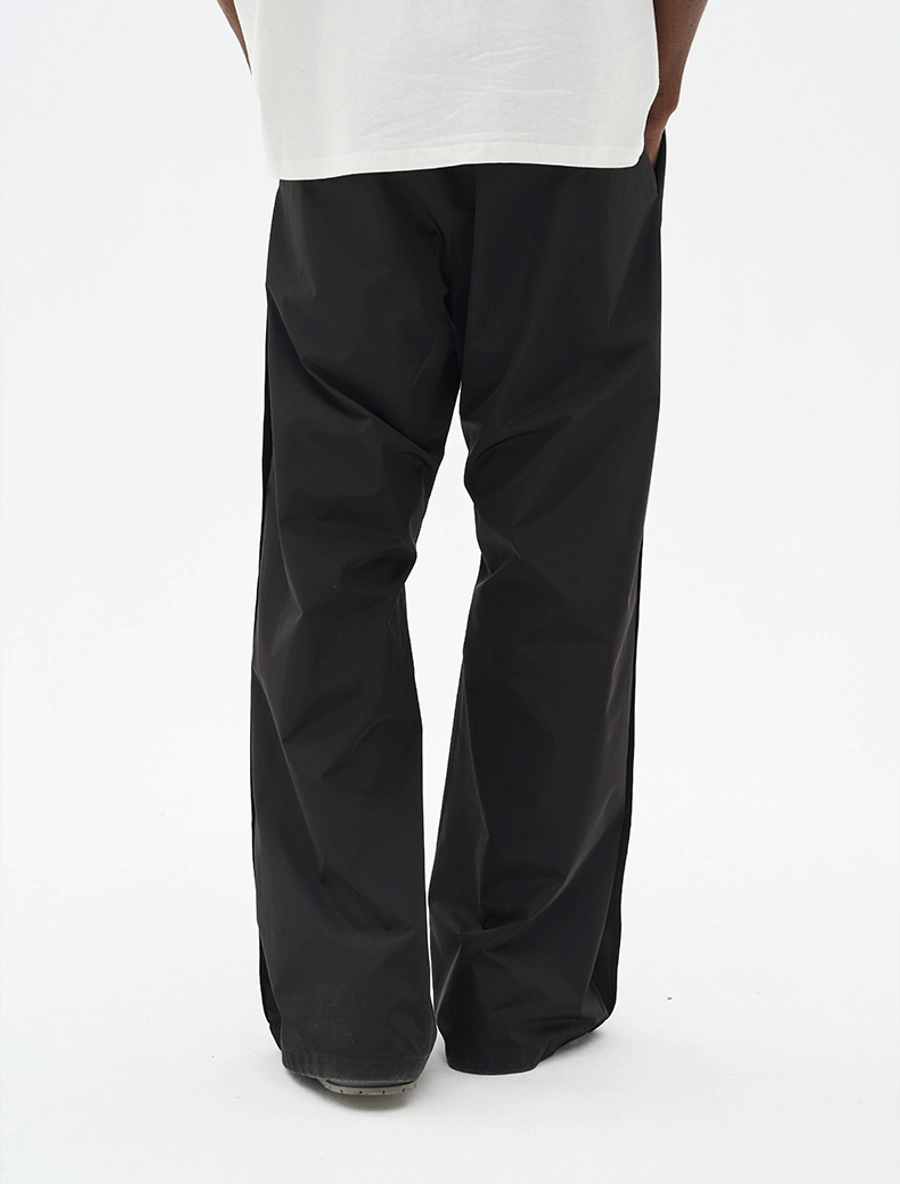 Брюки HARSHandCRUEL Wide fit Nylon Buttoned Pants