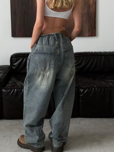 Широкие джинсы на кулиске с пятнами