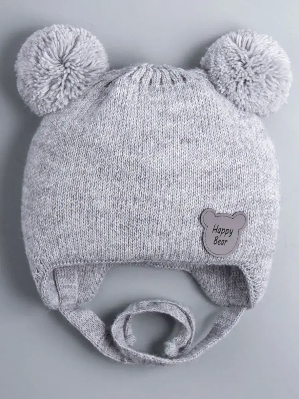 Шапка детская осенняя с завязками и помпонами