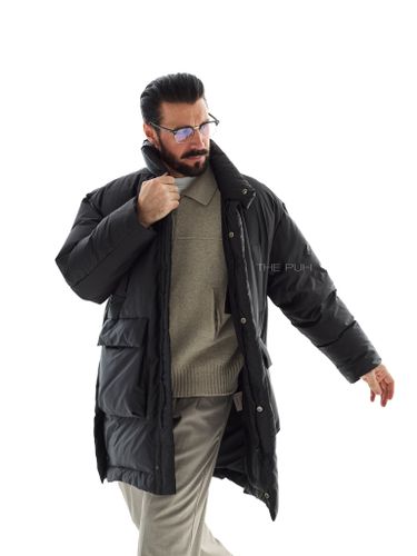 Удлиненный черный пуховик с карманами