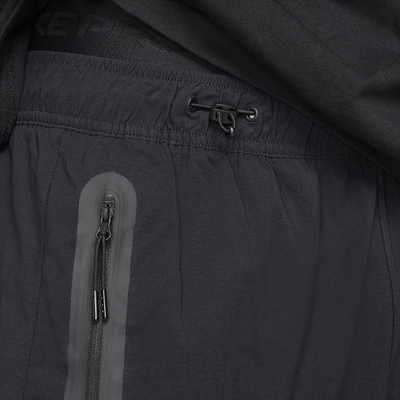 HM7158-010 Брюки M NK TCH WVN PANT OS