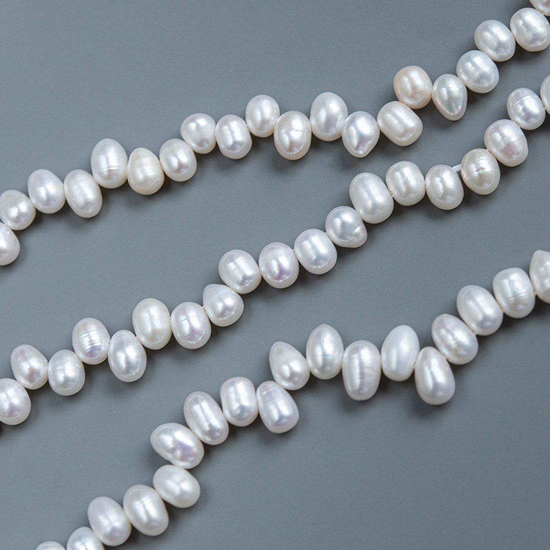 Жемчуг культивированный овальный со смещенным отверстием, белый, 5*7-7,5мм