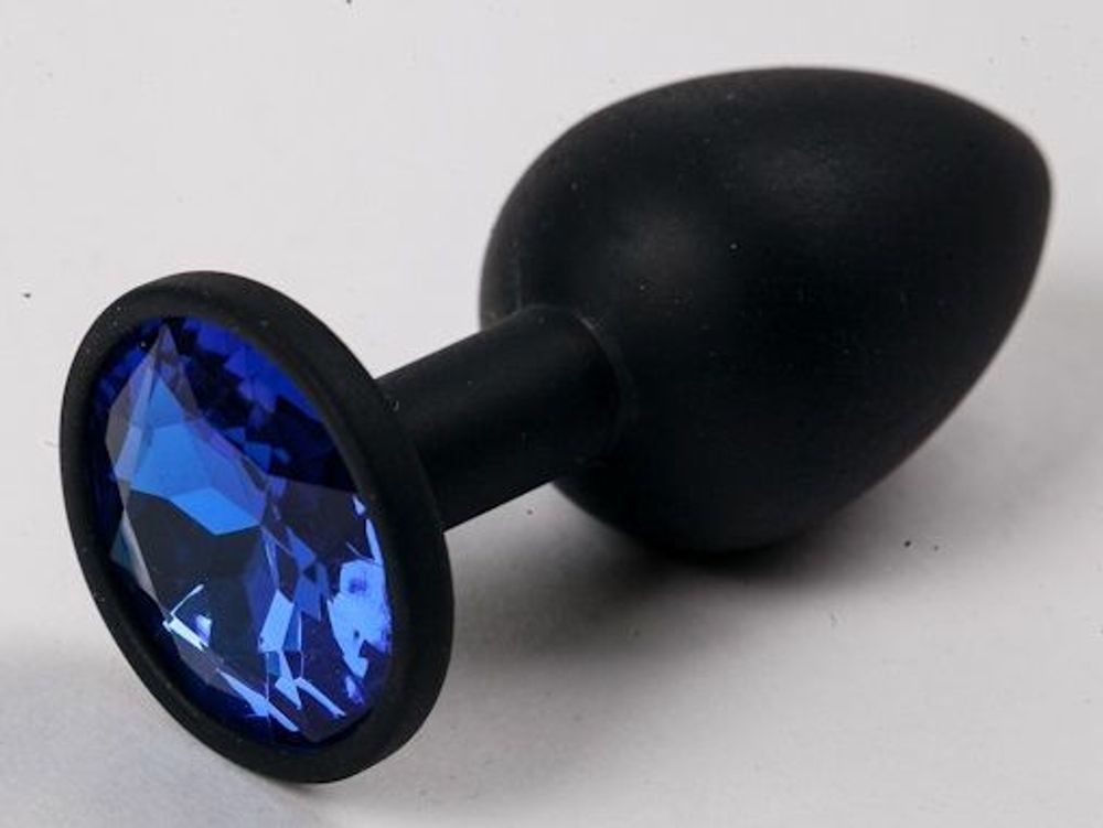 Черная силиконовая анальная пробка с синим стразом - 7,1 см.