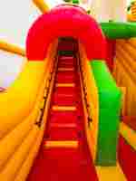 Детский надувной батут-горка "Слоник в джунглях" с прямым скатом 7*5*6 м