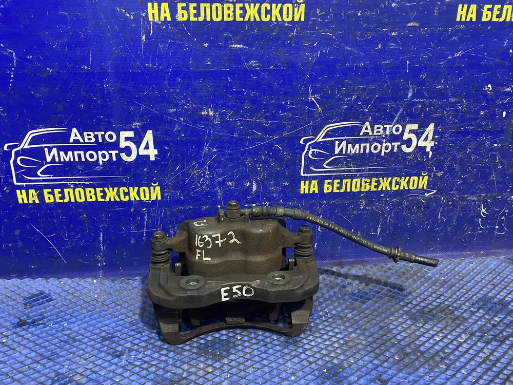 Суппорт тормозной передний левый NISSAN ELGRAND 1997-2002