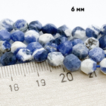 Содалит крупной огранки бусины, размер около 5,8-6 мм, цена за 27-28 шт (1/2 нити)