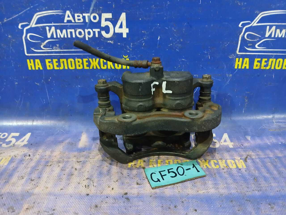 Суппорт тормозной передний левый NISSAN CIMA 2002