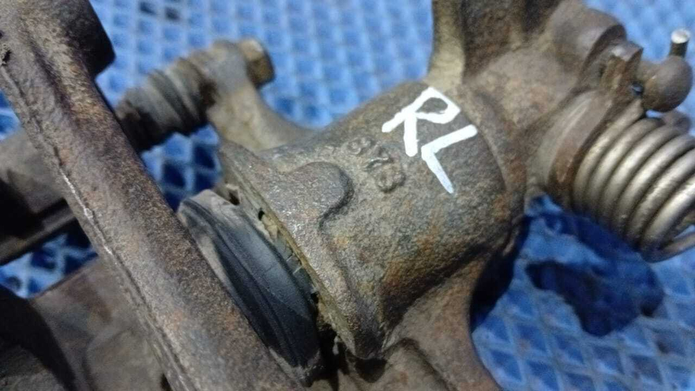 Суппорт тормозной задний левый NISSAN PRIMERA 1998