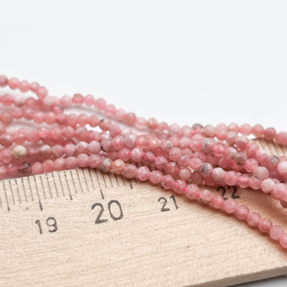 Родохрозит граненый бусины, диаметр 2,2-2,3 мм, цена за отрезок 19 см (1/2 нити)