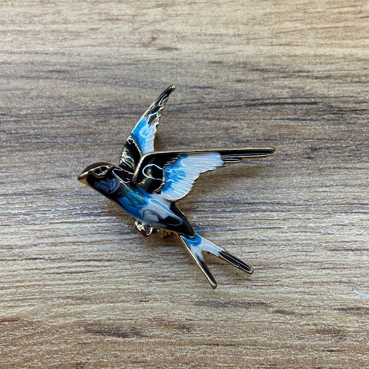 Брошь Ласточка эмаль белая голубая черная металл золотистый