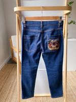 Джинсы Gucci, 140