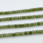 Фианит, рондель с огранкой, цвет зеленый , размер около 3,1*2,3 мм, цена за нить 38 см (около 165 шт)
