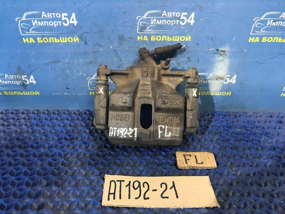 Суппорт тормозной передний левый TOYOTA CARINA 1994