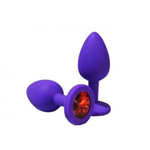 Анальная пробка из фиолетового силикона с красным кристаллом (размер S)